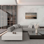 Groot canvas van een zonsondergang aan de Noordzeekust in Knokke, formaat 120x80cm, in een elegant interieur.